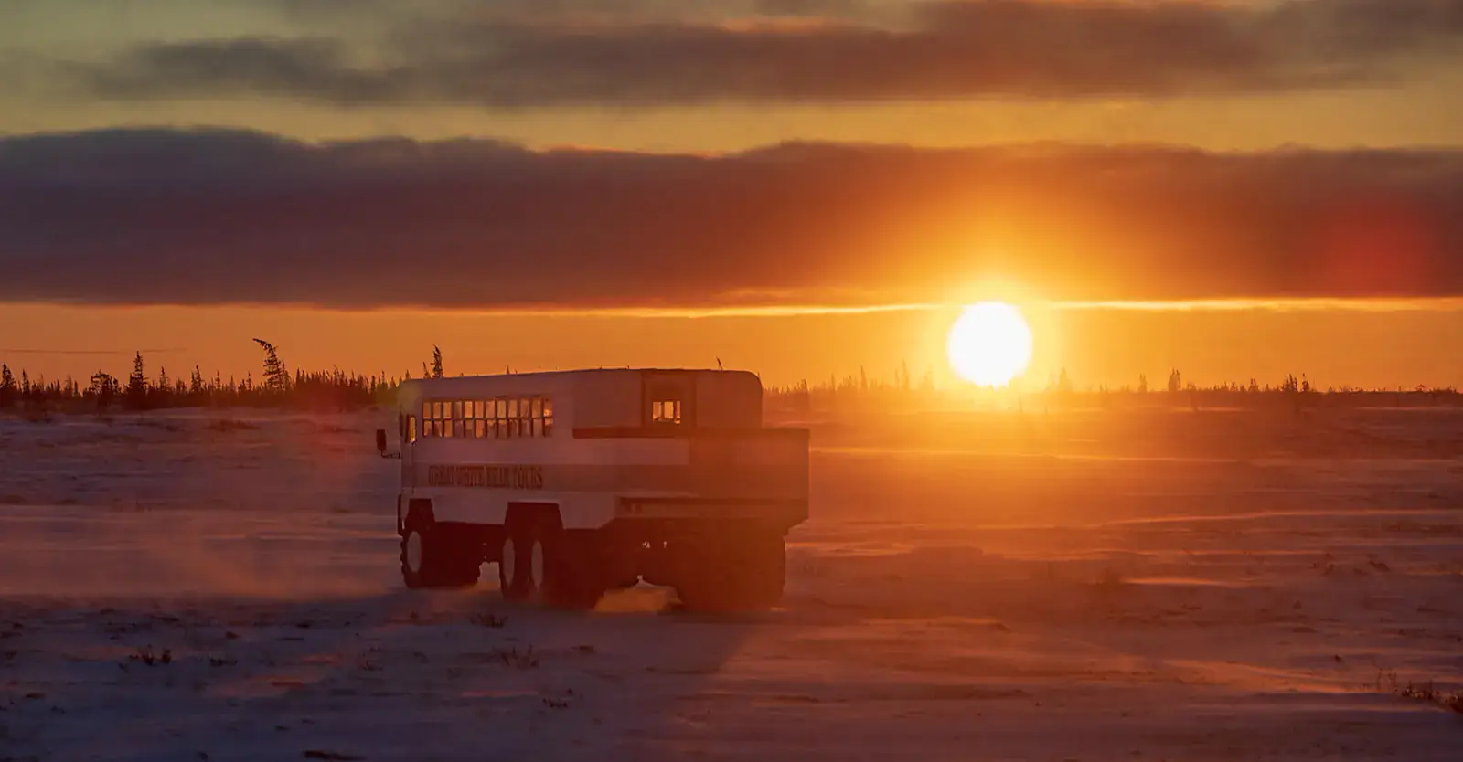 Polar Rover driving across the tundra at sunrise, Churchill