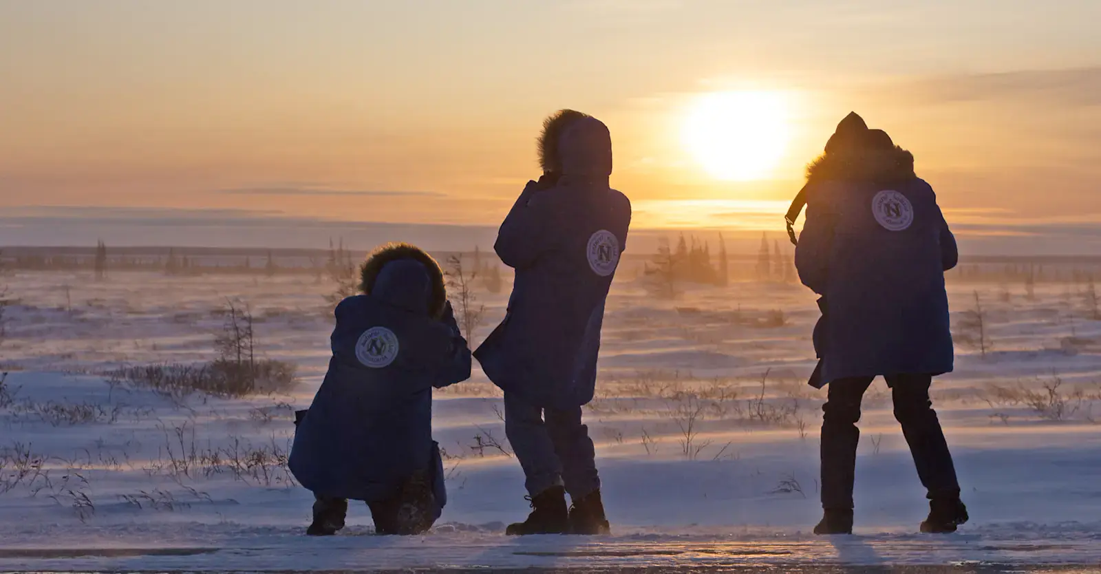 Guests photographing a tundra sunset near Churchill, Manitoba